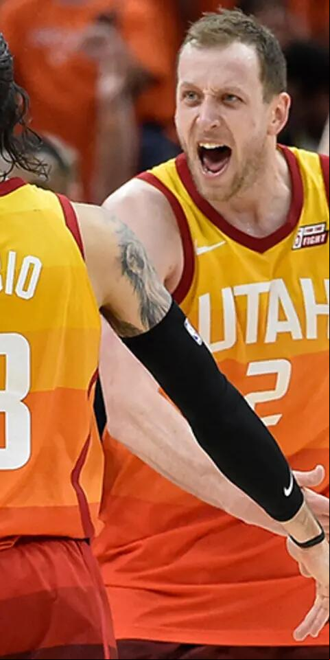 Joe Ingles of the Utah Jazz and Ricky Rubio react to Rubio's basket against the Oklahoma City Thunder