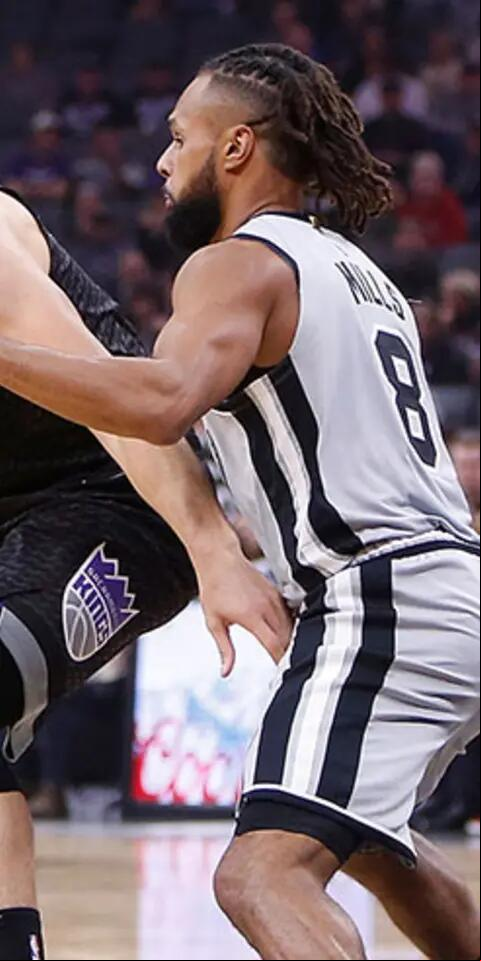 Bogdan Bogdanovic #8 of the Sacramento Kings looks to get by Patty Mills #8 of the San Antonio Spurs at Golden 1 Center on November 12, 2018 in Sacramento, California