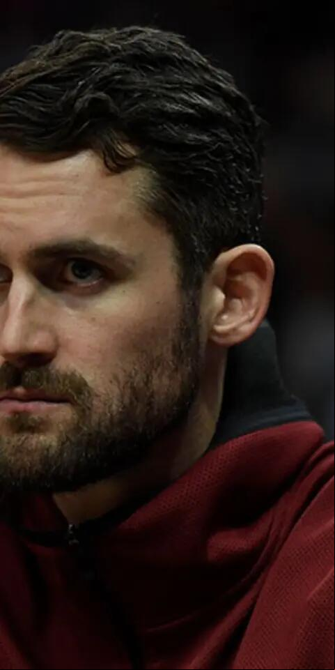 Kevin Love #0 of the Cleveland Cavaliers follows the game from the bench during the second half against Los Angeles Clippers at Staples Center on March 30, 2019 in Los Angeles, California.